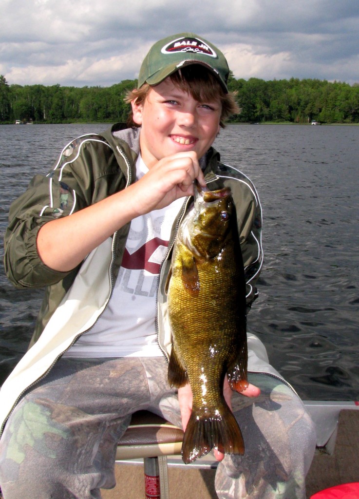 BOU-boy-with-smallmouth-bass-737x1024.jpg