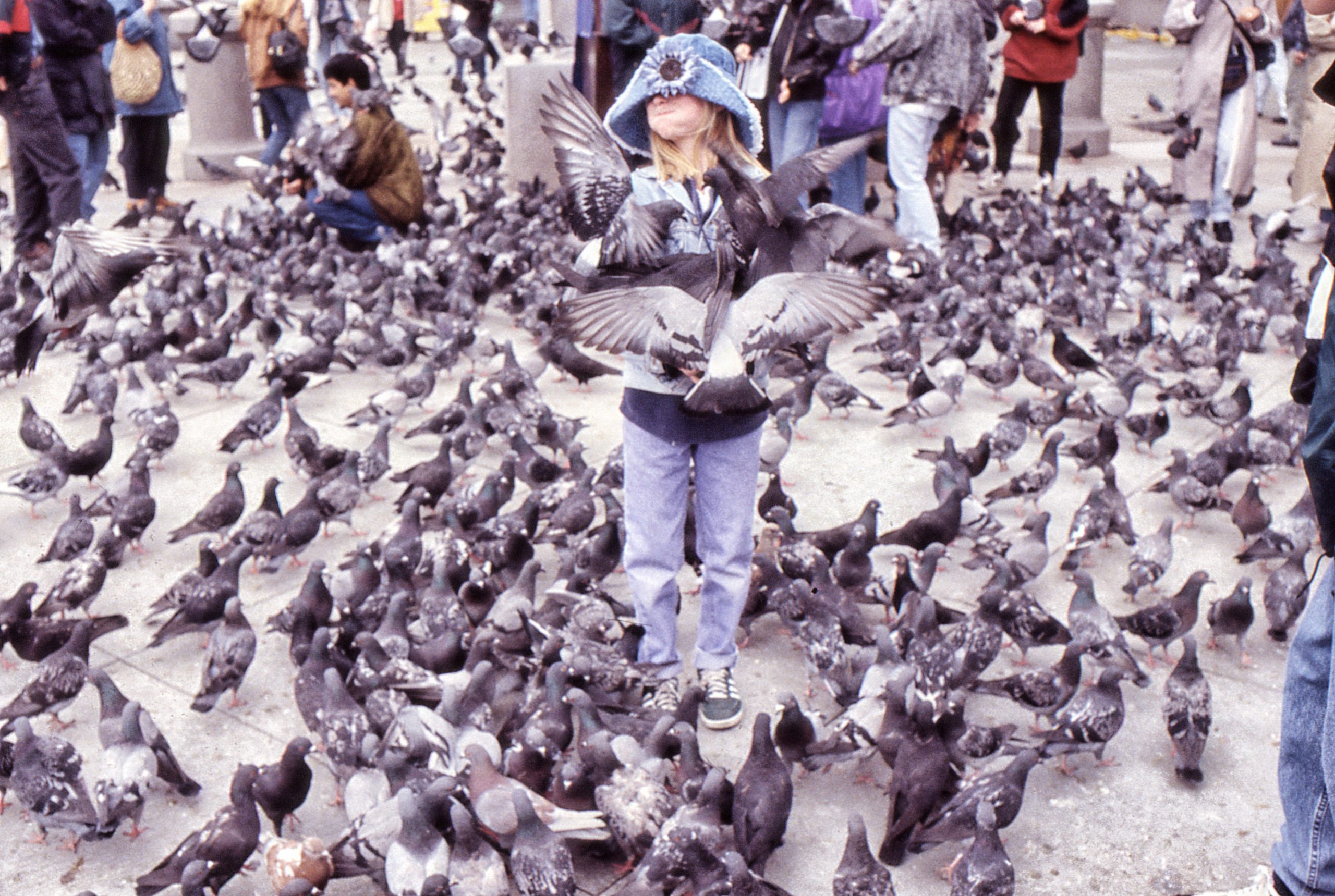 Our daughter and the Trafalgar Square pigeons.