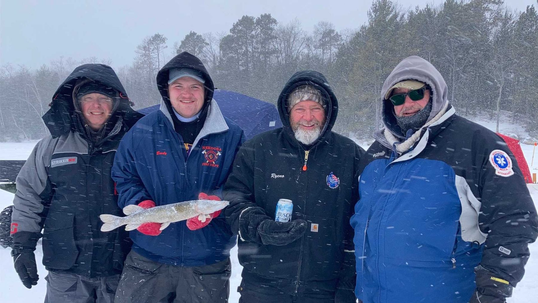 Article: Boulder Junction’s 14th Annual Frozen Tozen | Fishermen holding frozen fish