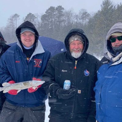 Related Article: Boulder Junction’s 14th Annual Frozen Tozen | Fishermen holding frozen fish