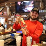 Article: Catch the big game at these iconic Wisconsin sports bars | Bartender at Gooch's 2 Bar & Grill Bouder Junction Wisconsin