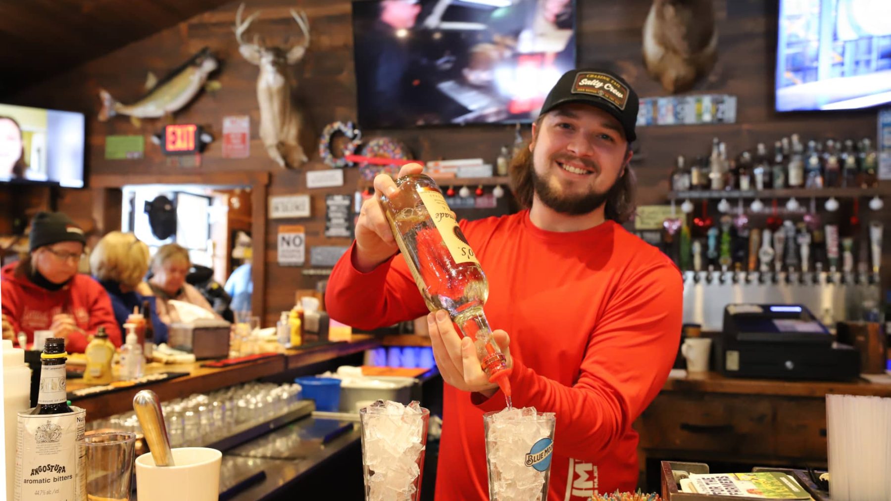 Article: Catch the big game at these iconic Wisconsin sports bars | Bartender at Gooch's 2 Bar & Grill Bouder Junction Wisconsin