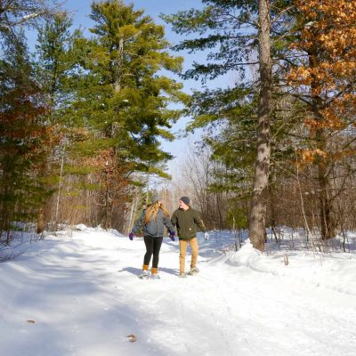 Related Article: Easy-to-explore winter trails | couple snowshoeing through Razorback Ridges Trails