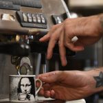 Article: Warm up at these coffee shops & cafes | barista making coffee at the daily grind in marshfield wisconsin