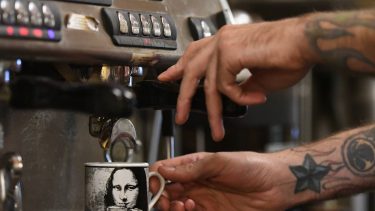 Article: Warm up at these coffee shops & cafes | barista making coffee at the daily grind in marshfield wisconsin