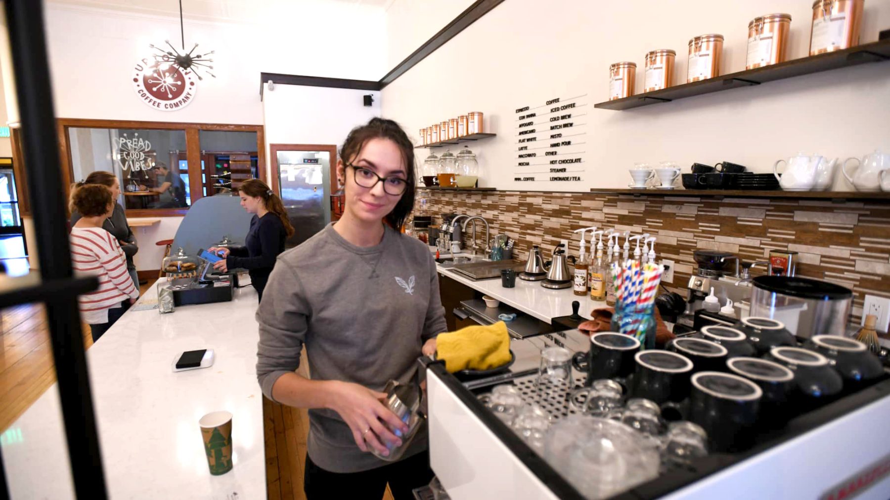 Article: Warm up at these coffee shops & cafes | Barista at Uptown Coffee Company Marshfield WI