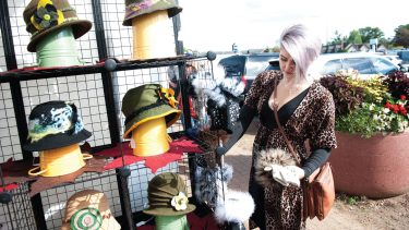 Article: Art fairs & craft shows you shouldn’t miss in Wisconsin | Woman shopping at Prime Choice Craft Fair in Minocqua WI