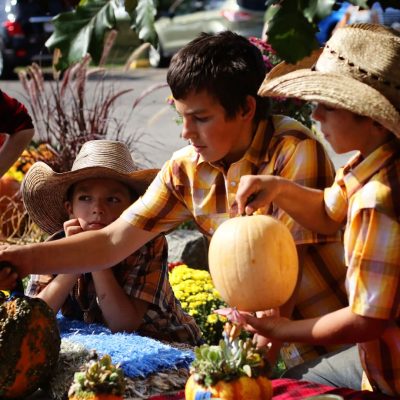 Find your Wisconsin Travel Inspiration | Join the fun in central Wisconsin at Maple Fall Fest: Mother and son at Wildwood Park in Marshfield WI in fall