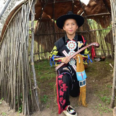 Find your Wisconsin Travel Inspiration | Wisconsin history museums worth a visit: Boy at pow wow in Lac du Flambeau Vilas County Wisconsin