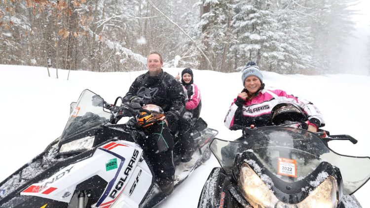 Article: See why Boulder Junction is a snowmobiler’s paradise | Family on snowmobile trails in Boulder Junction Wisconsin