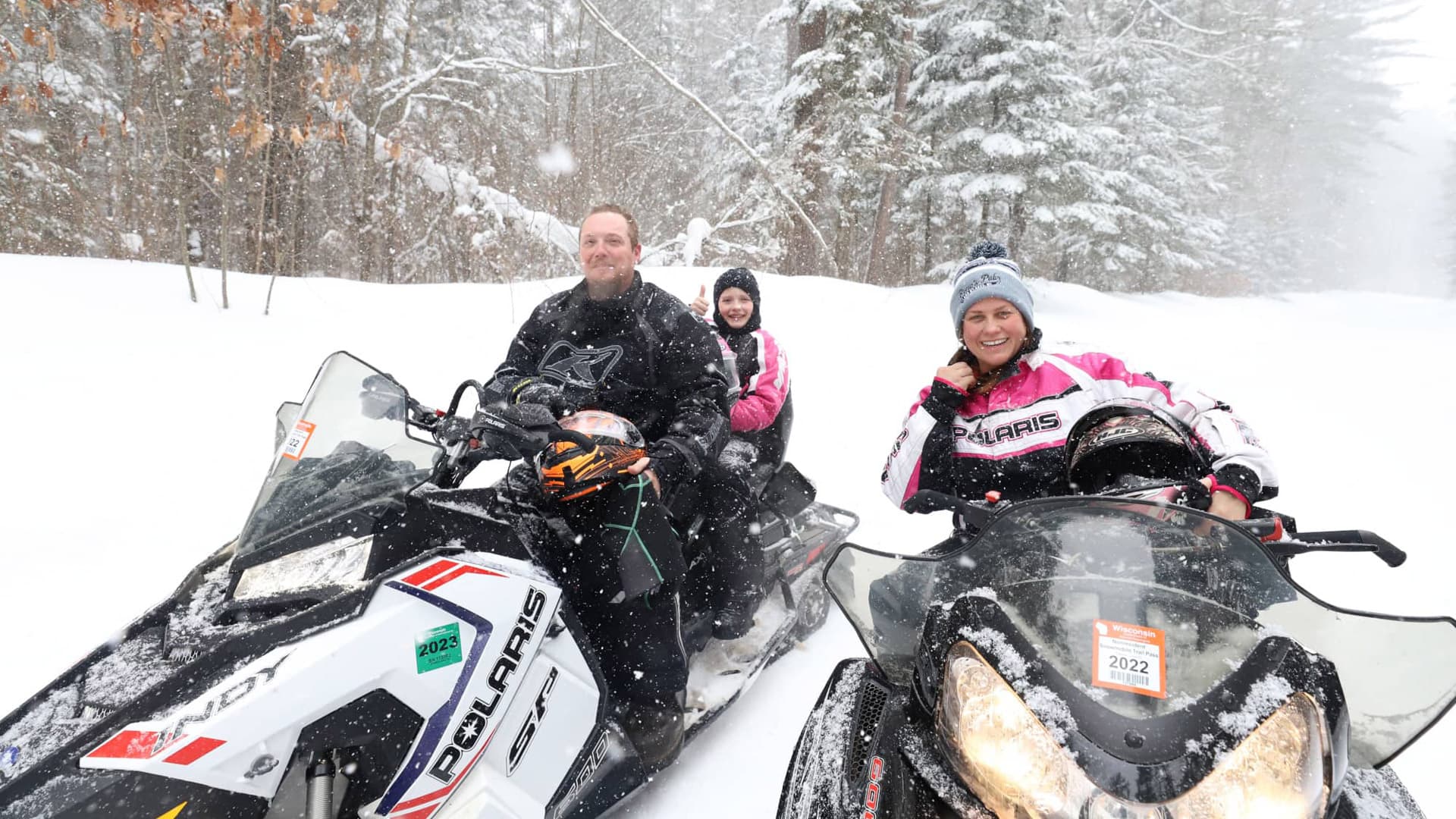 Family on snowmobile trails in Boulder Junction Wisconsin