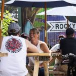 Article: 4 patios & beer gardens to visit this summer | People sitting at the outdoor beer garden at Rocky Reef Brewing Company in Woodruff Wisconsin