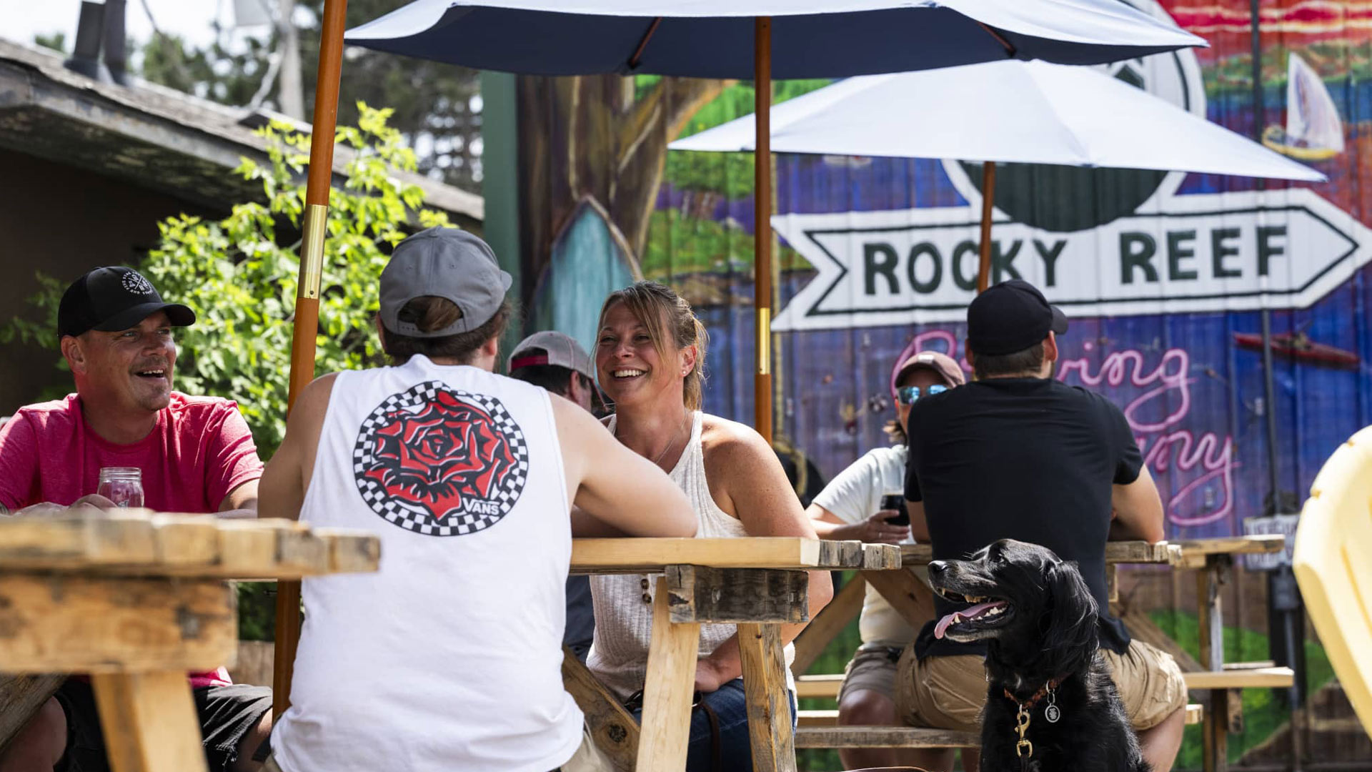 People sitting at the outdoor beer garden at Rocky Reef Brewing Company in Woodruff Wisconsin