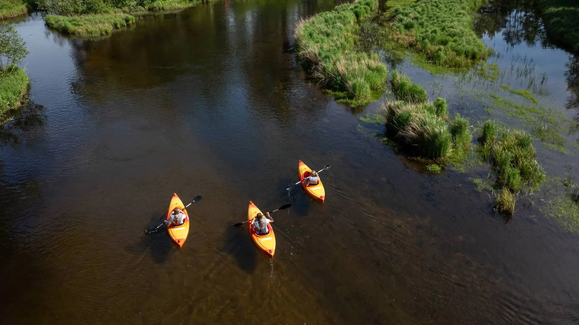 Three kayaks on the Manitowish River in Vilas County Wisconsin