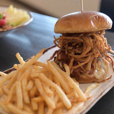 Related Article: Where to find a great burger in Wood & Marathon Counties | Burger on plate at The Rivers restaurant at Holiday Inn & Conference Center in Marshfield WI