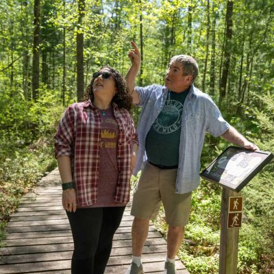 Related Article: 5 hikes to try this spring in Wisconsin | Man and woman hiking on North Trout Lake Trail in Boulder Junction in Vilas County Wisconsin