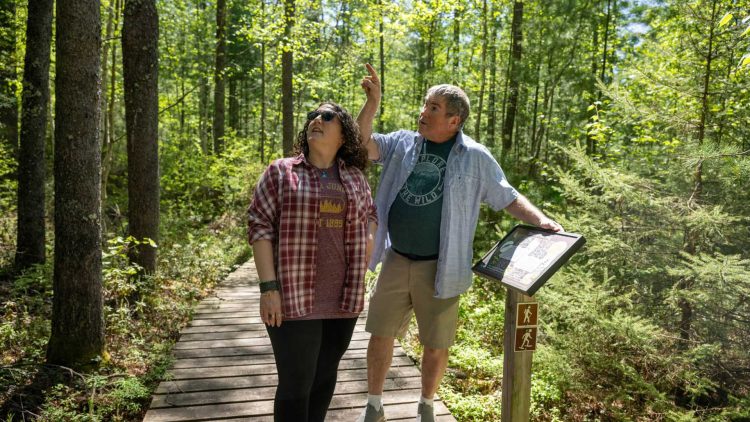 Article: 5 hikes to try this spring in Wisconsin | Man and woman hiking on North Trout Lake Trail in Boulder Junction in Vilas County Wisconsin