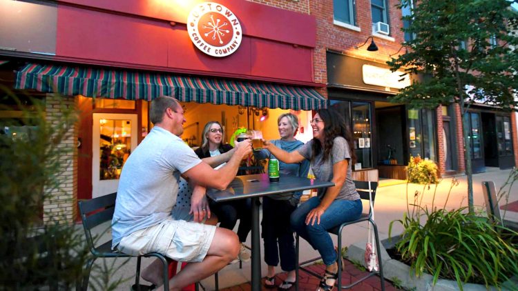Article: Outdoor dining options in Marshfield | People sitting outside at Uptown Coffee Company Marshfield WI